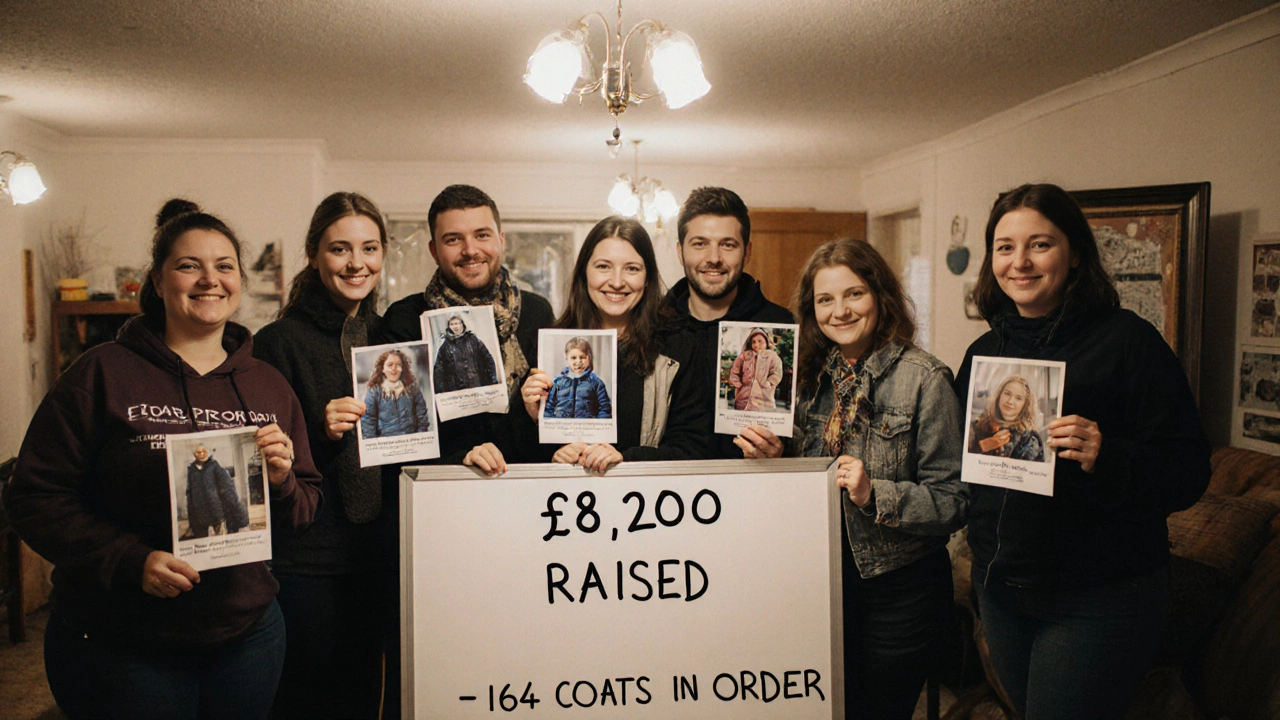 Volunteers smiling beside a whiteboard showing funds raised and coats ordered.